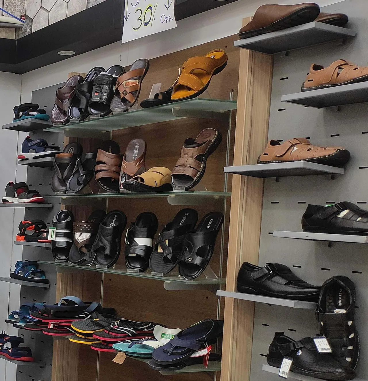 Sandal and chappal display wall at Raja Footwear