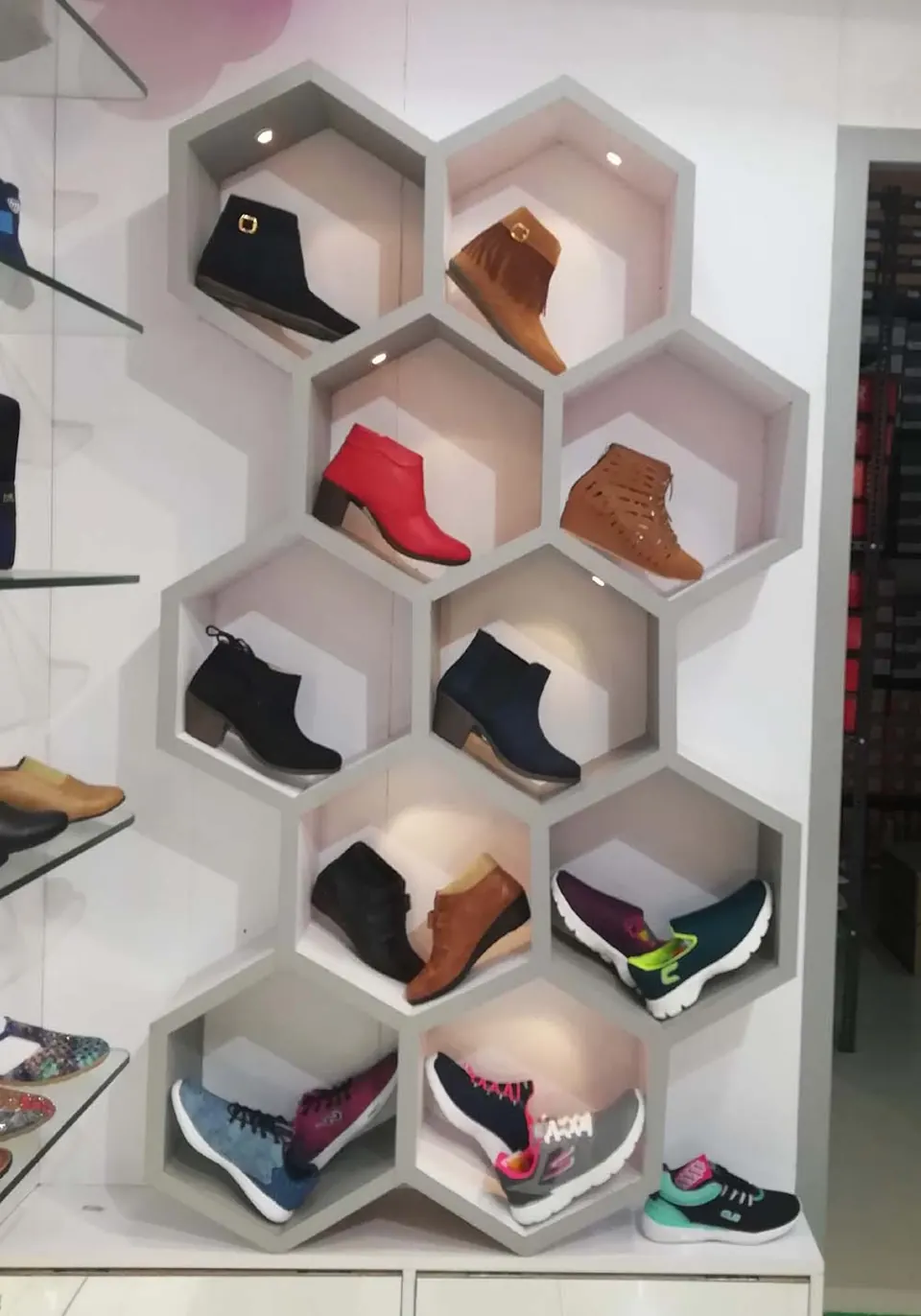 Hexagon display of ladies' boots and heeled footwear in store