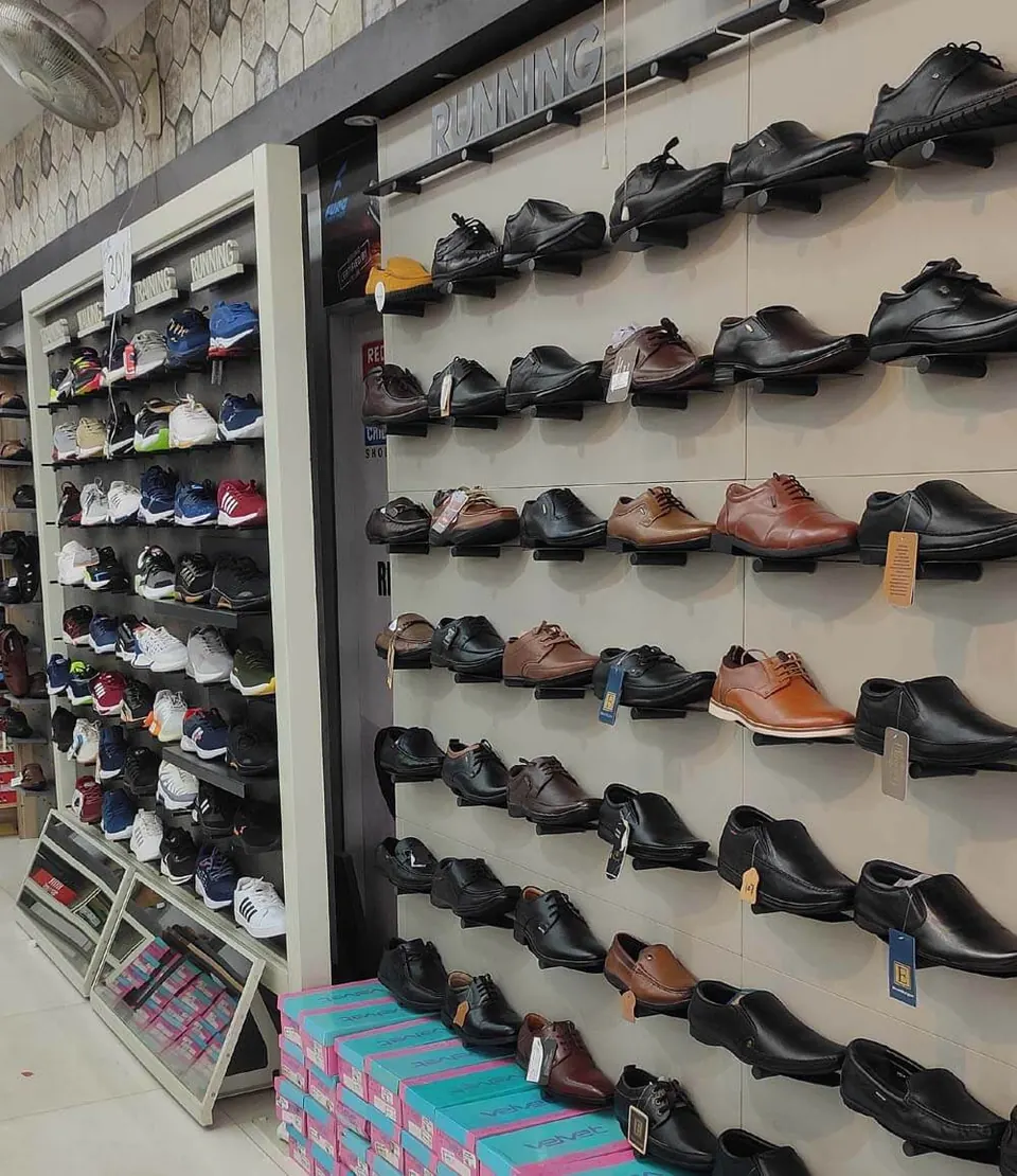 Wall display of men's formal leather shoes at Raja Footwear, Waidhan