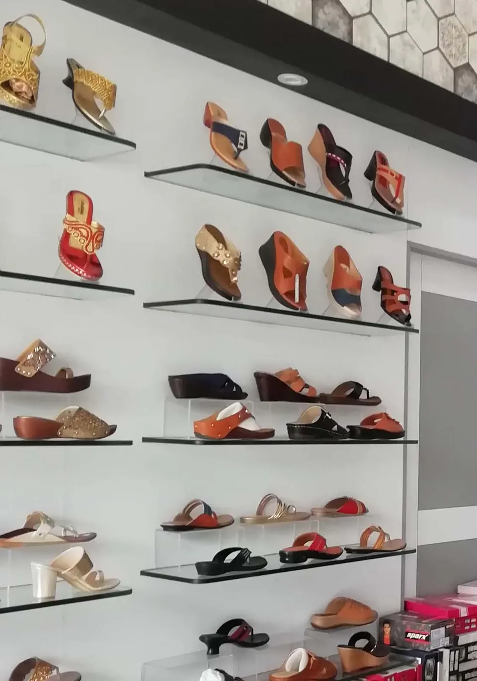 Shelves of ladies' sandals and chappals in the showroom